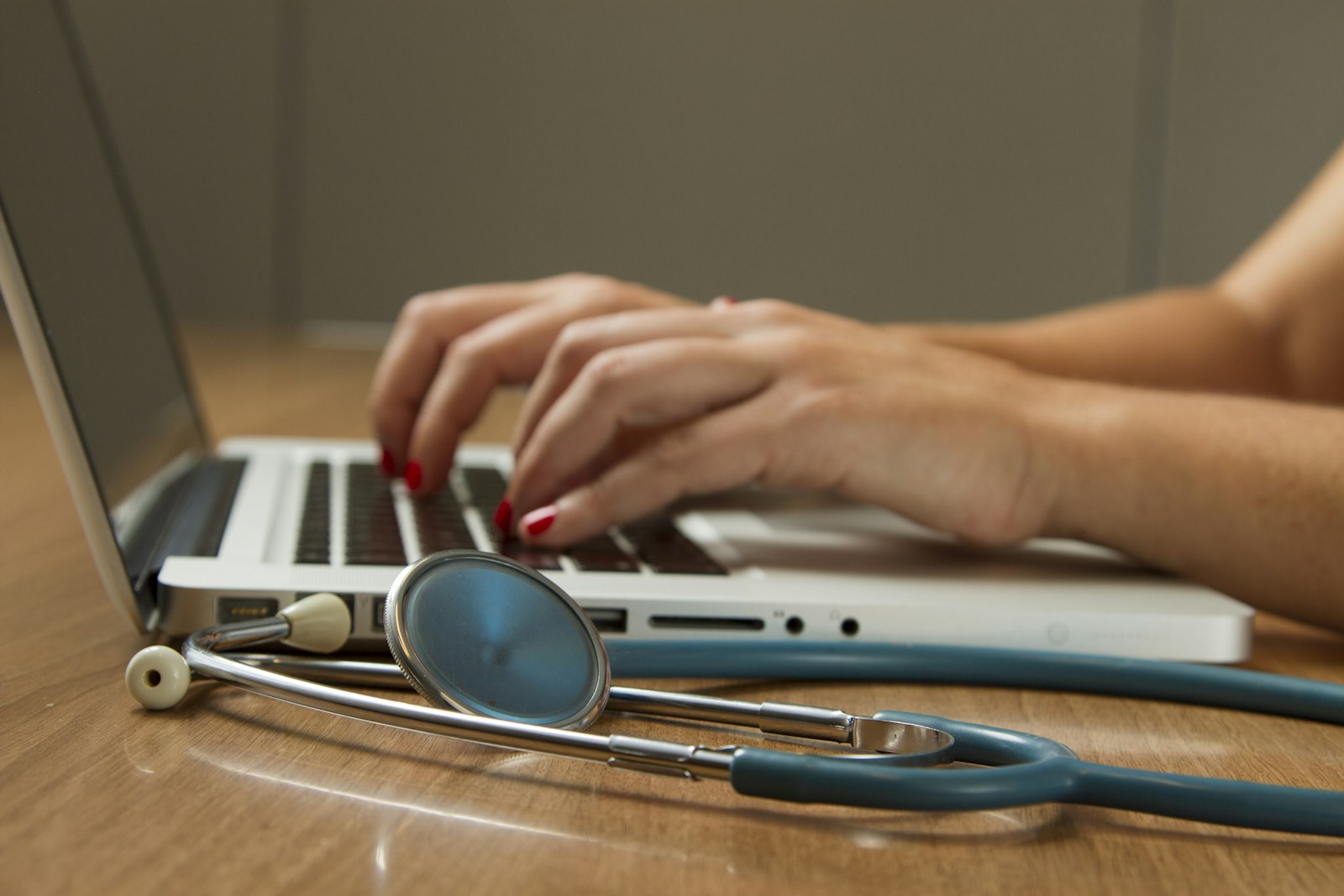 Healthcare team — nurses in scrubs and a clinician in white coat